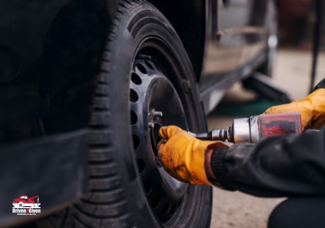 man is replacing the tire